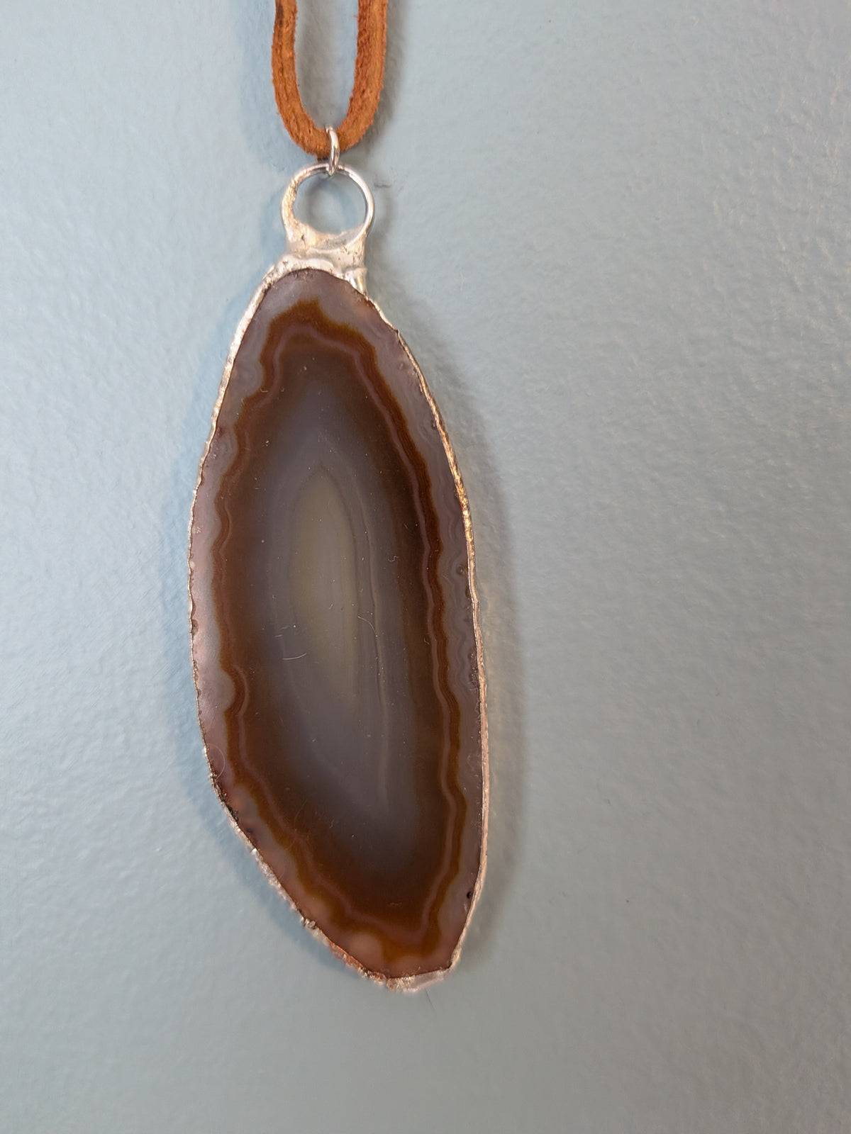 Necklace No. 002: alternate close-up of the banded agate and handmade silver-tone edging.