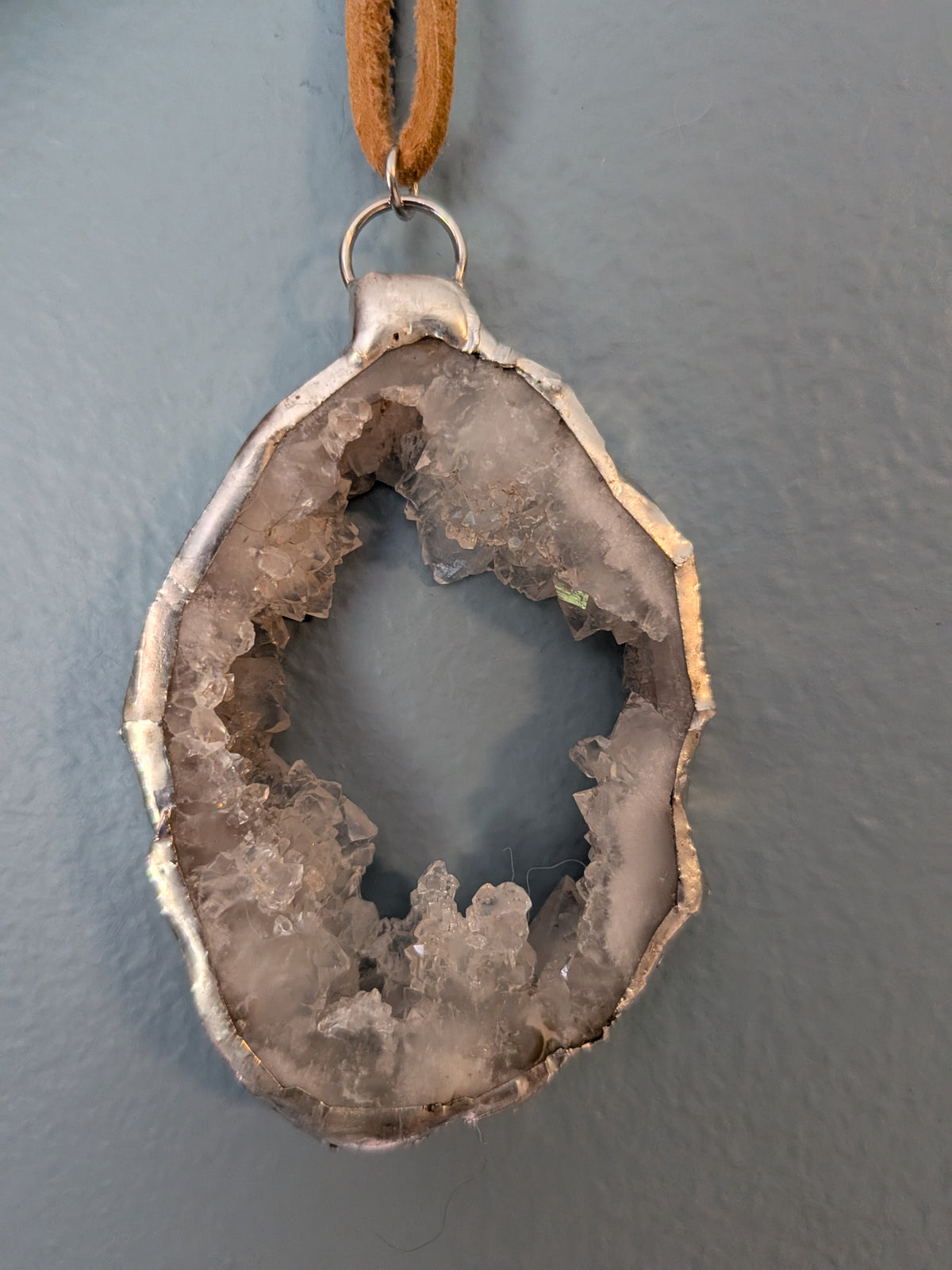 Necklace No. 010: alternate close-up of the white geode, natural stone detail and handmade silver-tone edging.