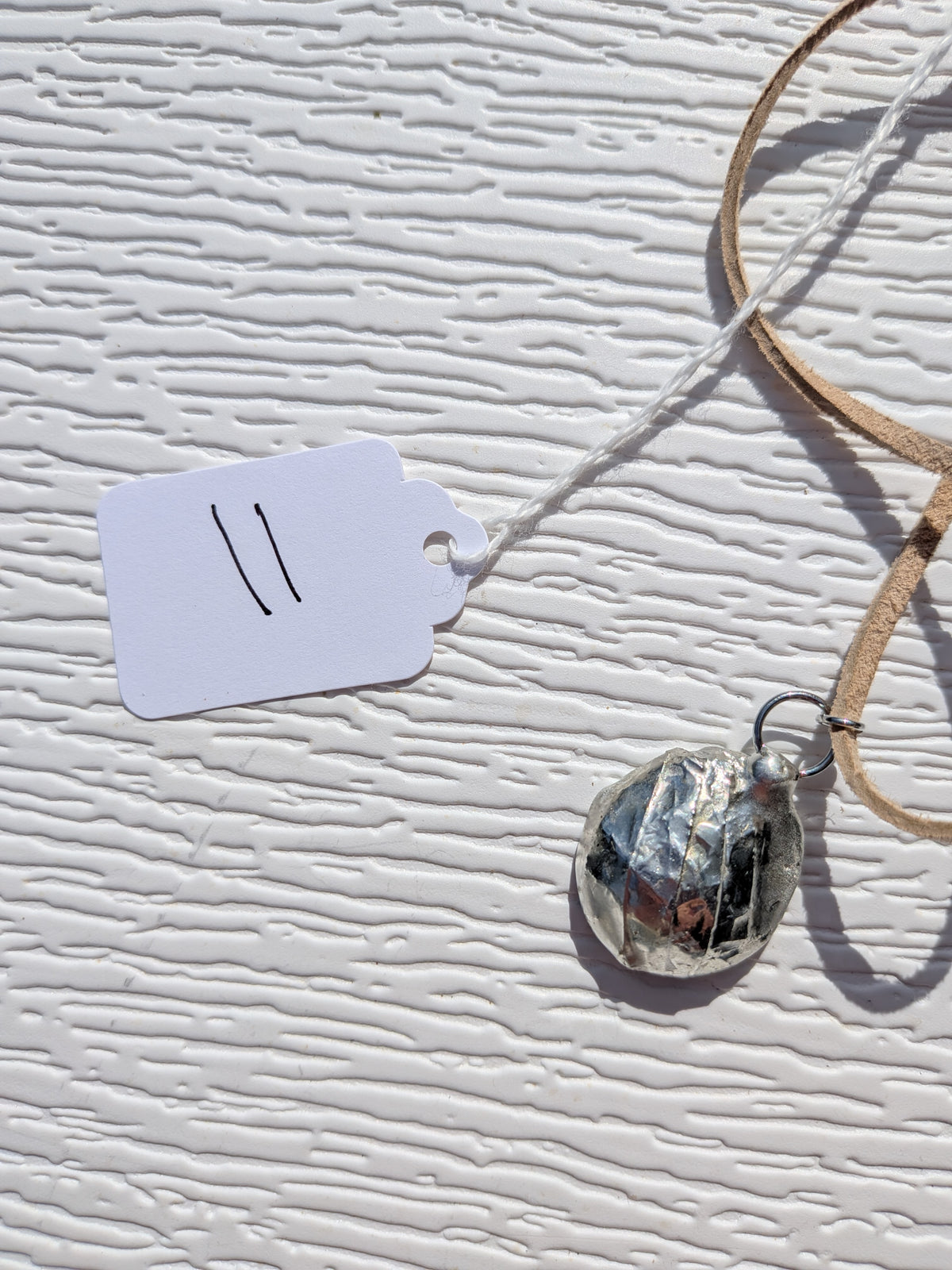 Back of Silver Mist Banded necklace No. 011, showing its silver-tone reverse and handmade finish.