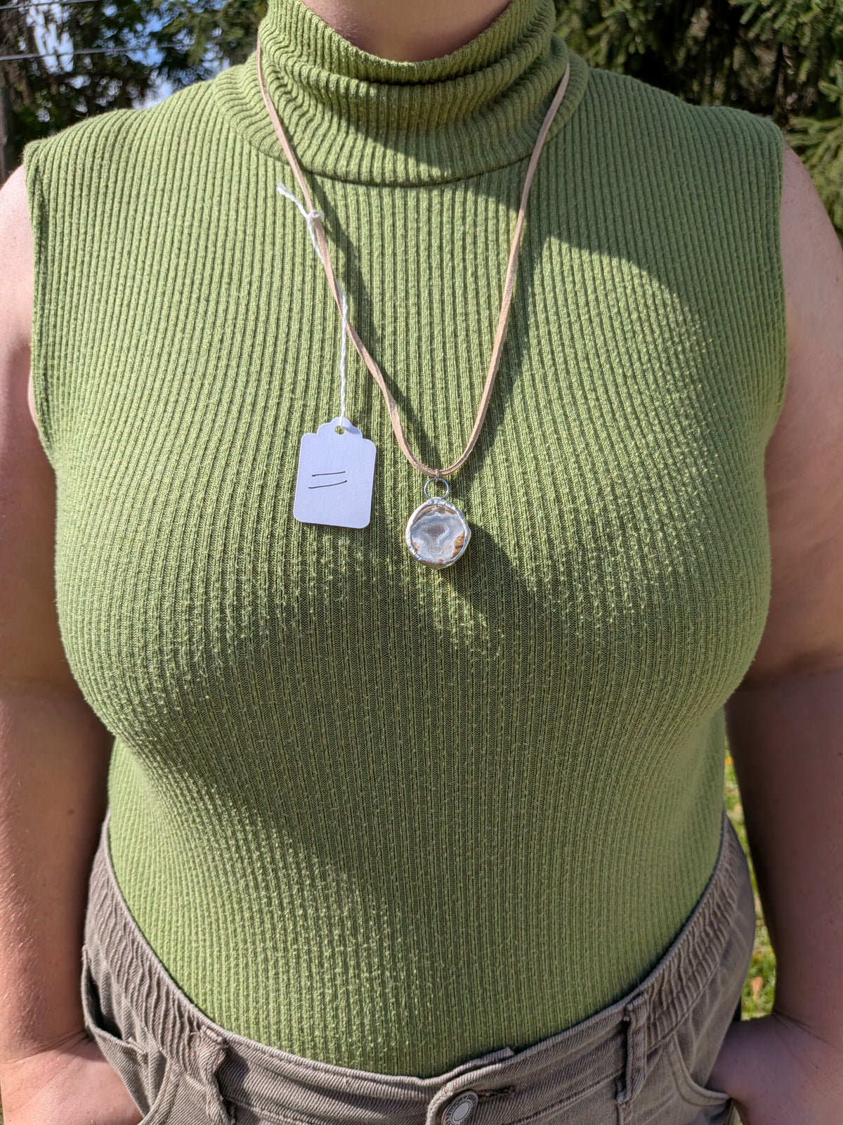 Silver Mist Banded necklace No. 011 worn on the body, showing the pendant's proportions and tan cord.
