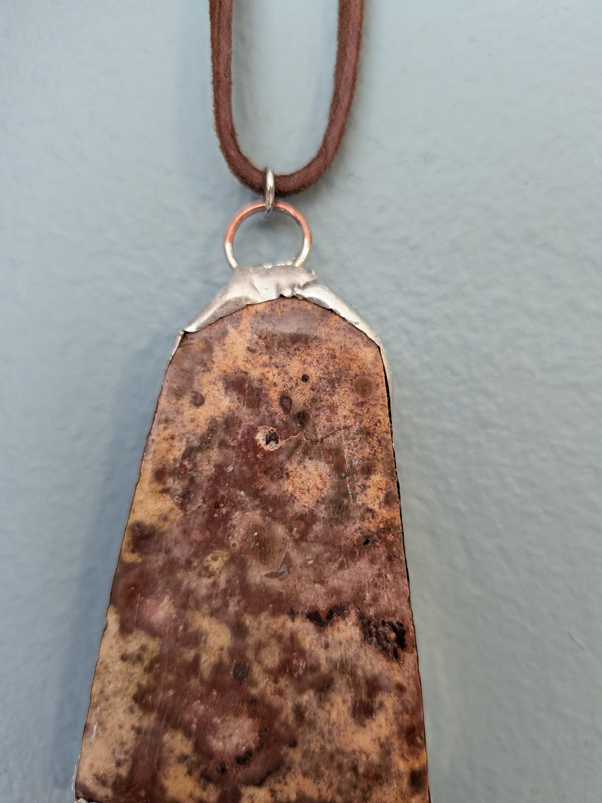 Necklace No. 013: front close-up of the stone, natural stone detail and handmade silver-tone edging.