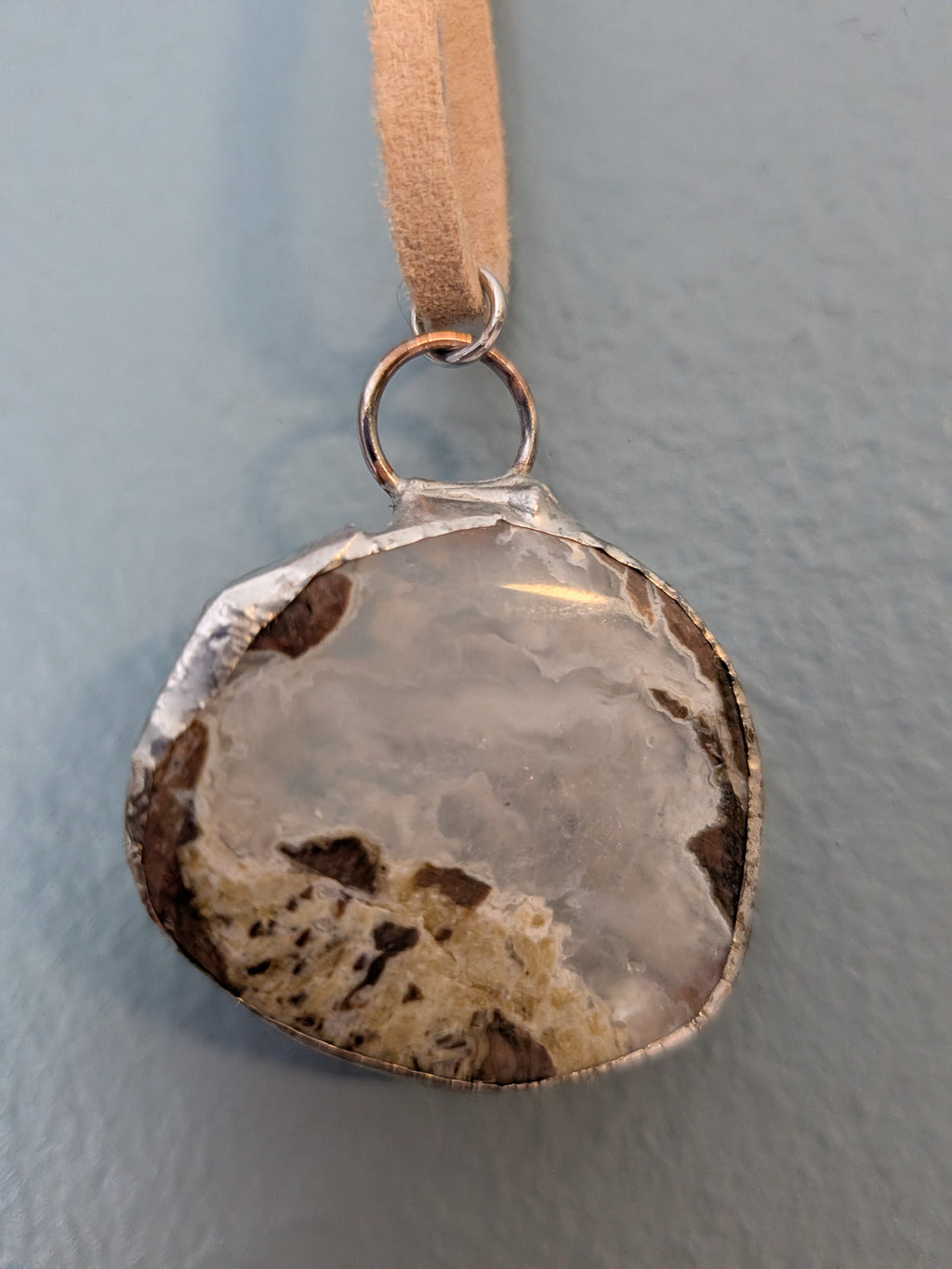 Necklace No. 014: front close-up of the blue agate, natural stone detail and handmade silver-tone edging.