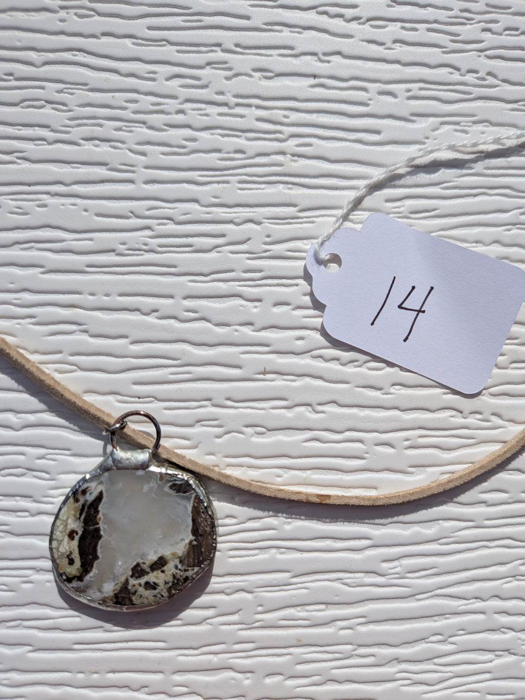 Back of Cloud Meadow necklace No. 014, showing the natural stone contours and handmade silver-tone edge.