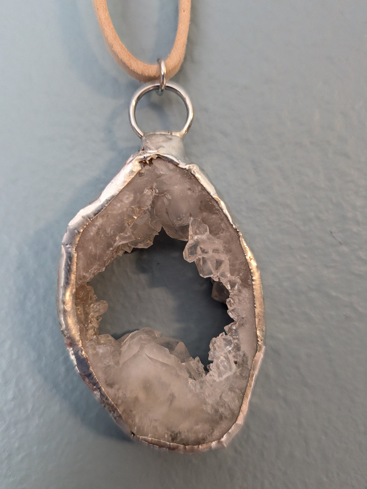 Necklace No. 015: alternate close-up of the white geode, natural stone detail and handmade silver-tone edging.