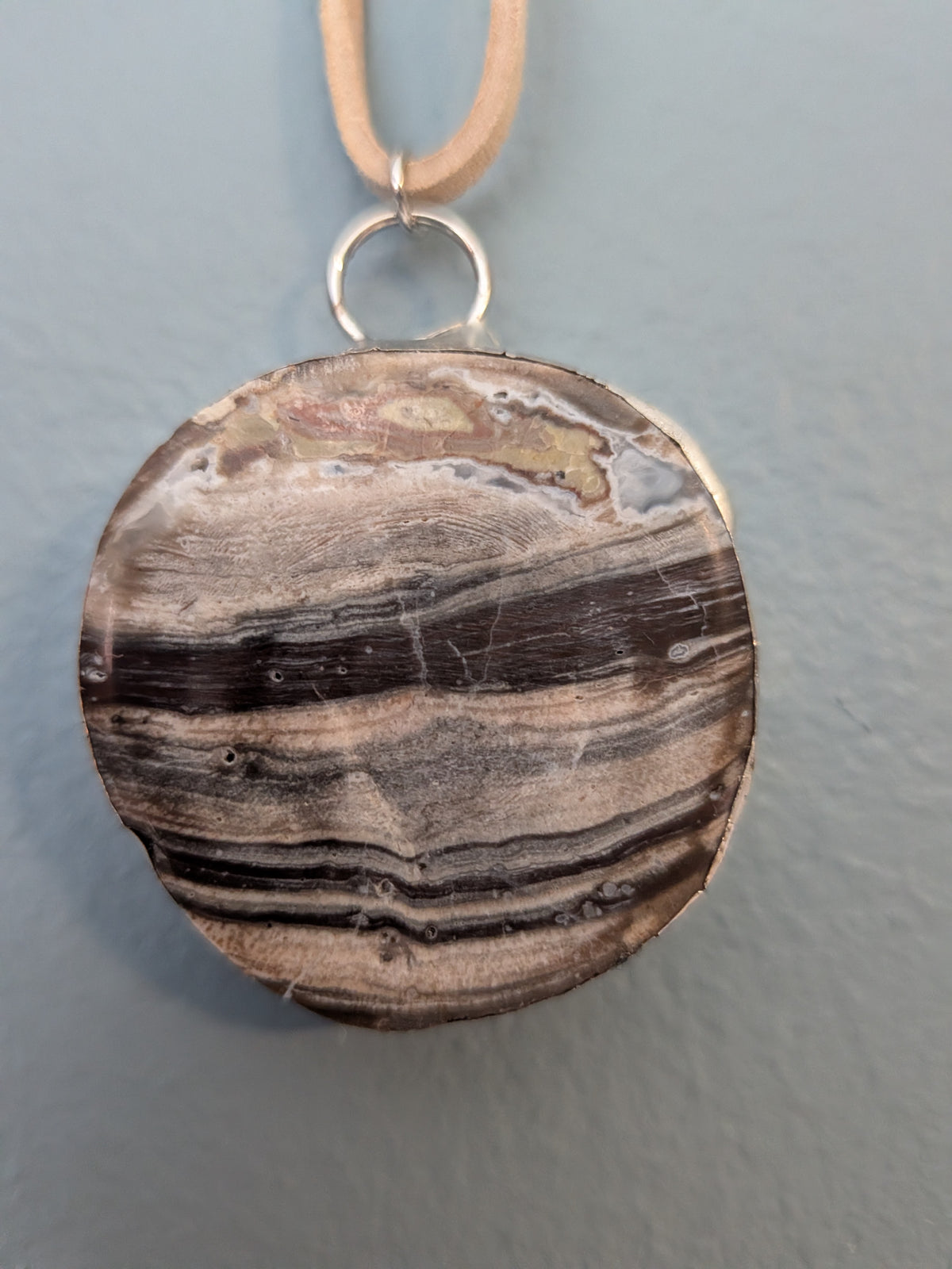 Necklace No. 016: front close-up of the stone, natural stone detail and handmade silver-tone edging.