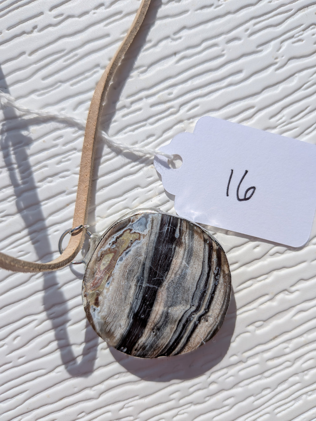 Back of River Strata necklace No. 016, showing the natural stone contours and handmade silver-tone edge.