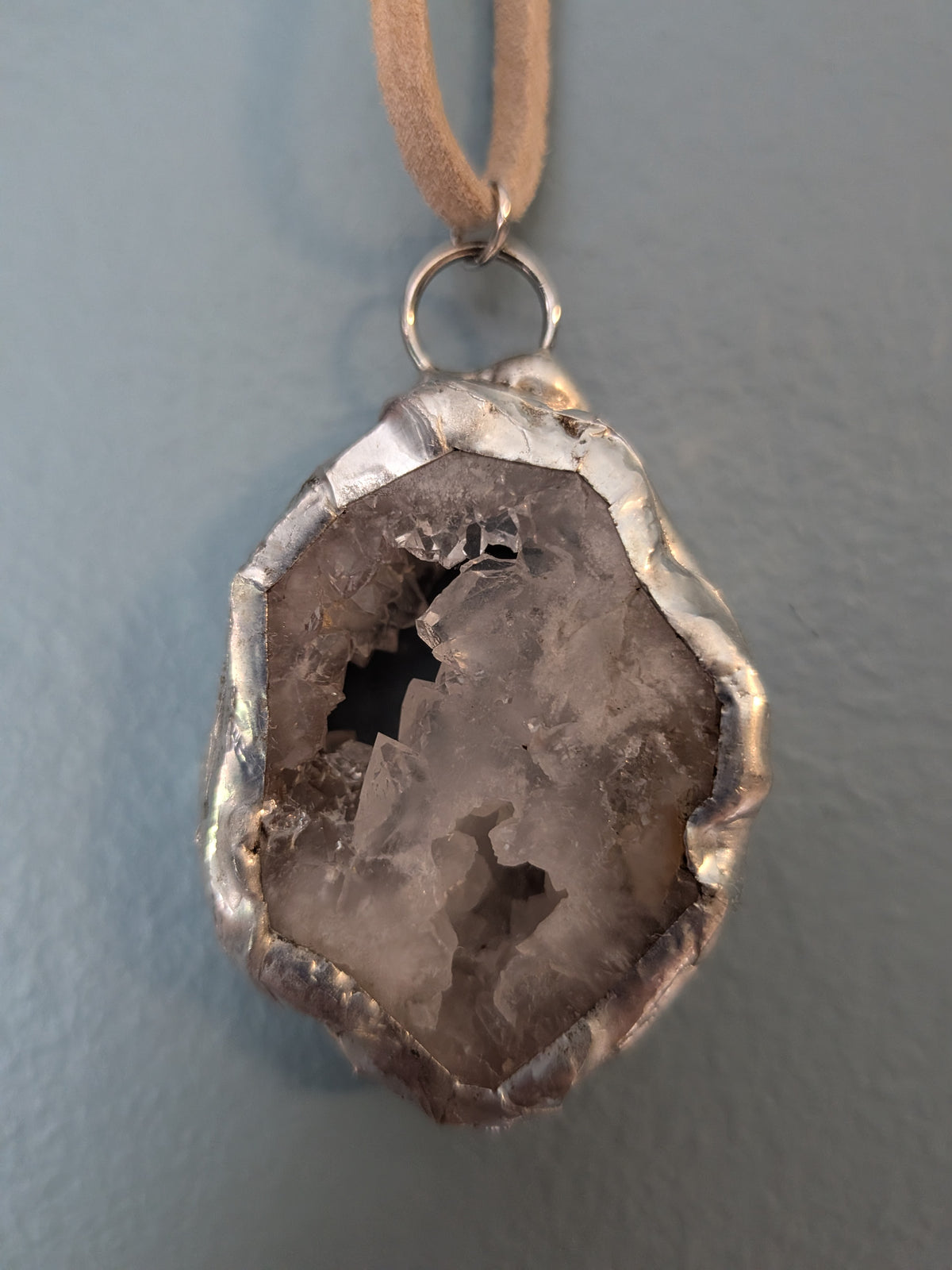 Necklace No. 017: alternate close-up of the white geode, natural stone detail and handmade silver-tone edging.