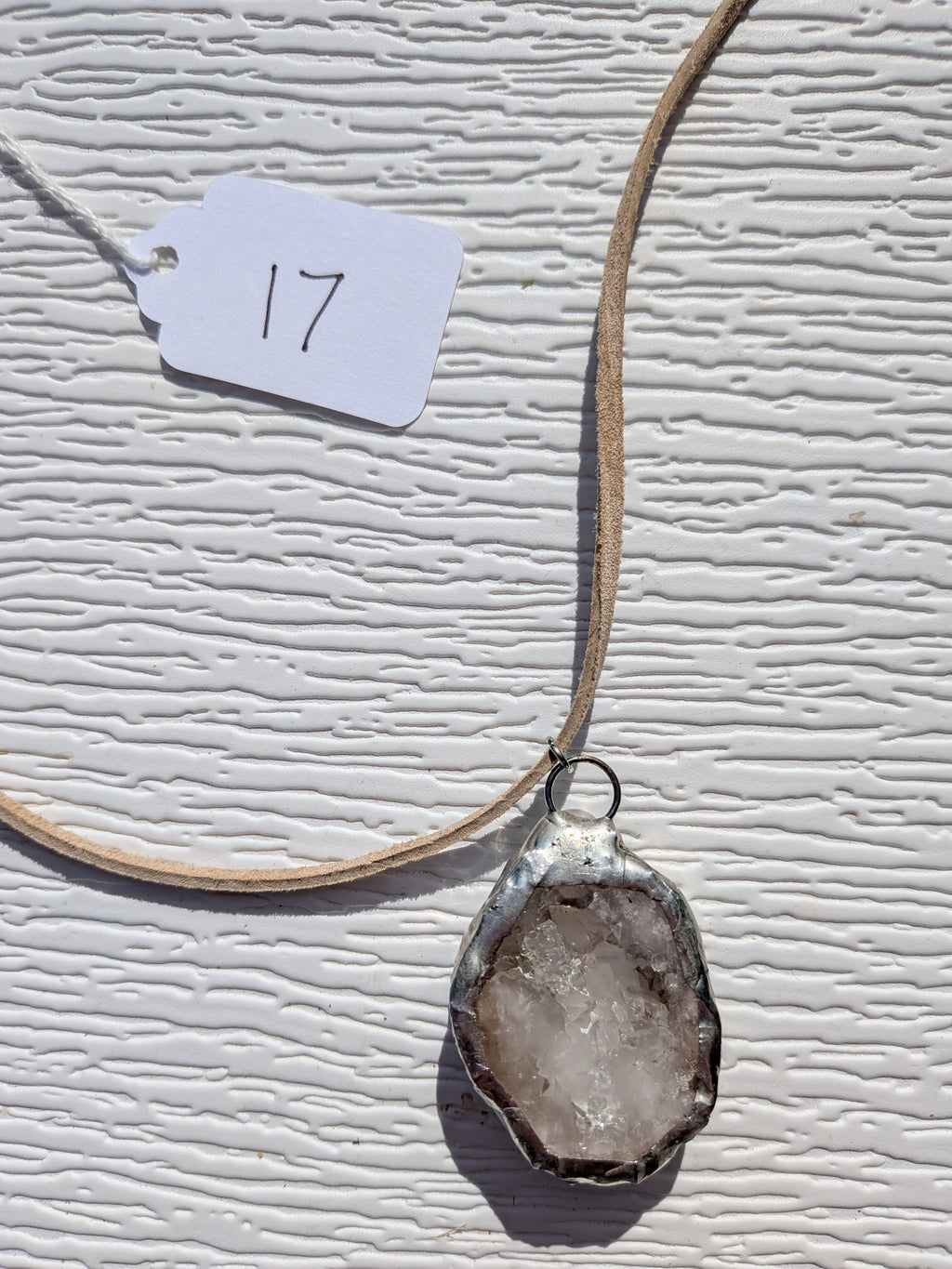Back of Smoky Frost necklace No. 017, showing the natural stone contours and handmade silver-tone edge.
