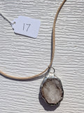 Back of Smoky Frost necklace No. 017, showing the natural stone contours and handmade silver-tone edge.