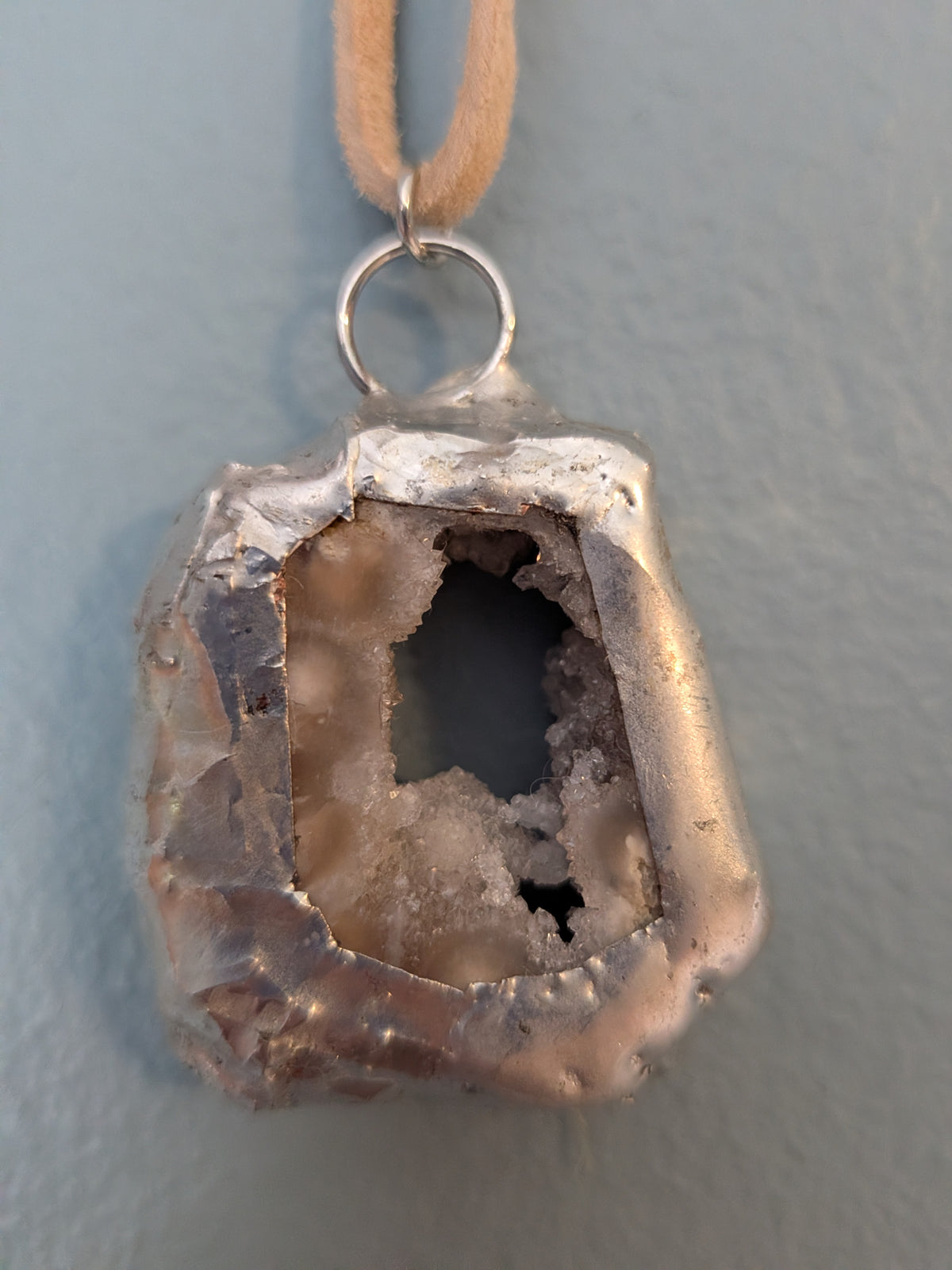 Necklace No. 018: alternate close-up of the white geode, natural stone detail and handmade silver-tone edging.