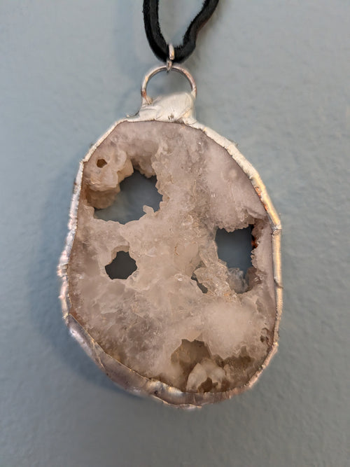Necklace No. 001: reverse close-up showing cream crystals, natural openings and handmade silver-tone edging.