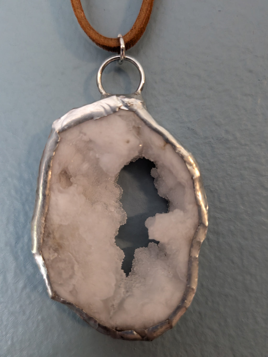 Necklace No. 020: alternate close-up of the white geode, natural stone detail and handmade silver-tone edging.