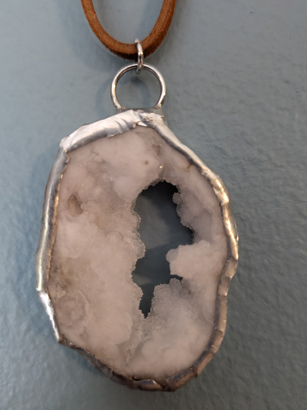 Necklace No. 020: alternate close-up of the white geode, natural stone detail and handmade silver-tone edging.