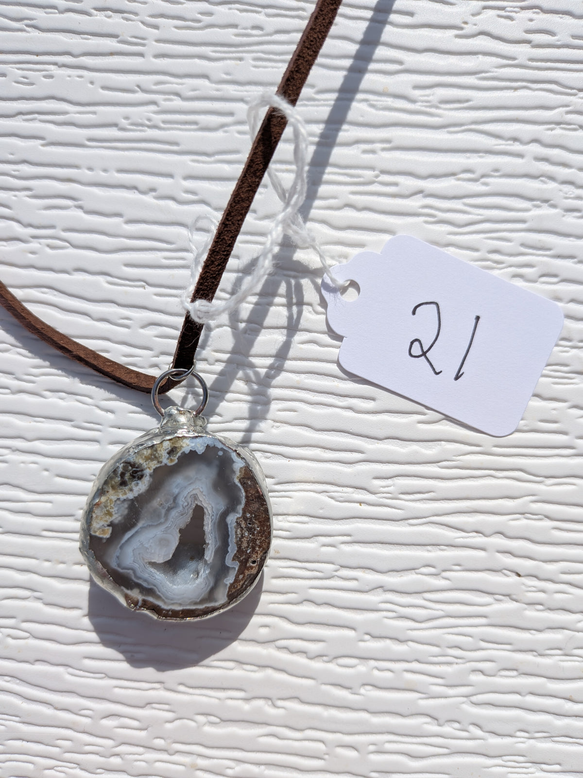 Back of Mountain Hollow necklace No. 021, showing the natural stone contours and handmade silver-tone edge.