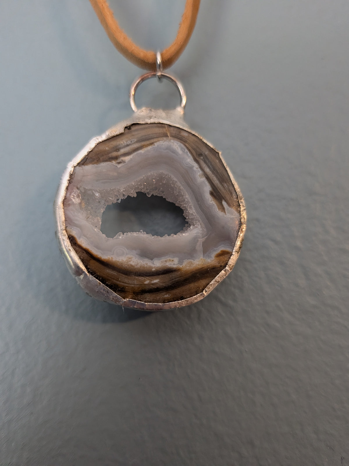 Necklace No. 007: front close-up of the dugway geode, natural stone detail and handmade silver-tone edging.