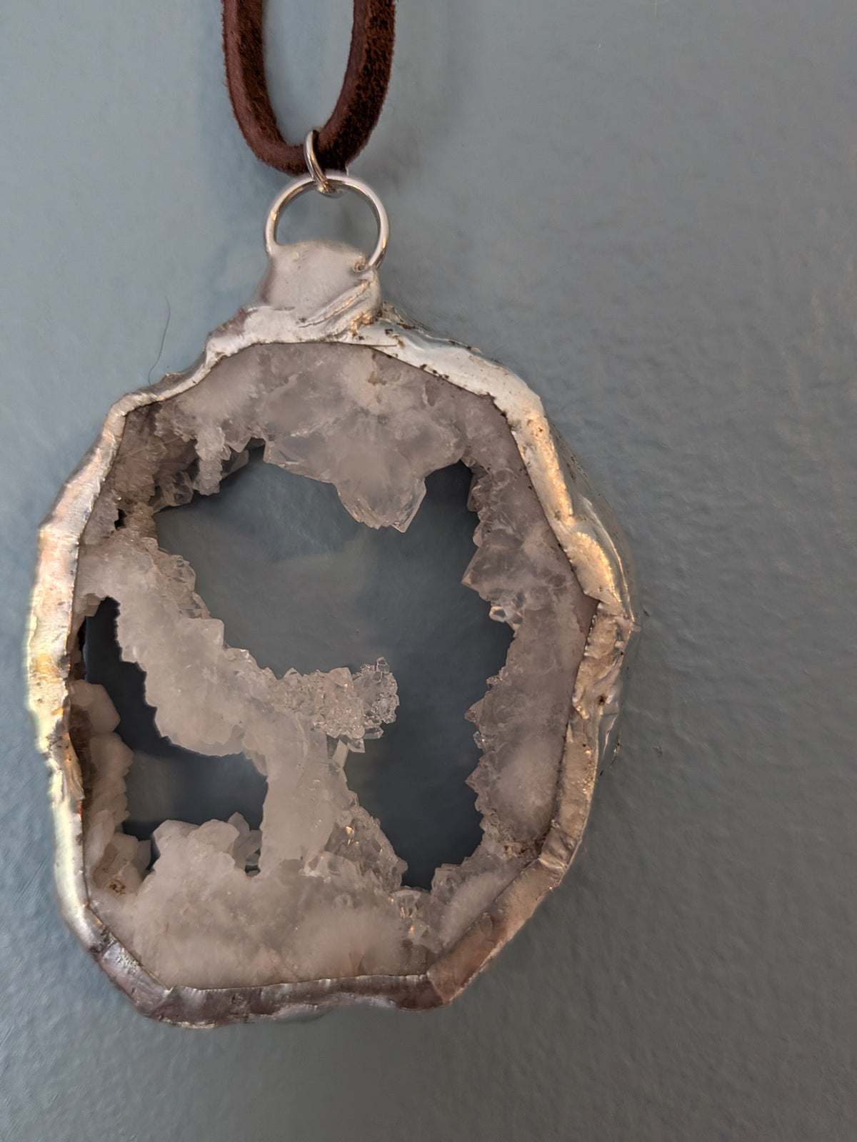 Necklace No. 009: alternate close-up of the white geode, natural stone detail and handmade silver-tone edging.